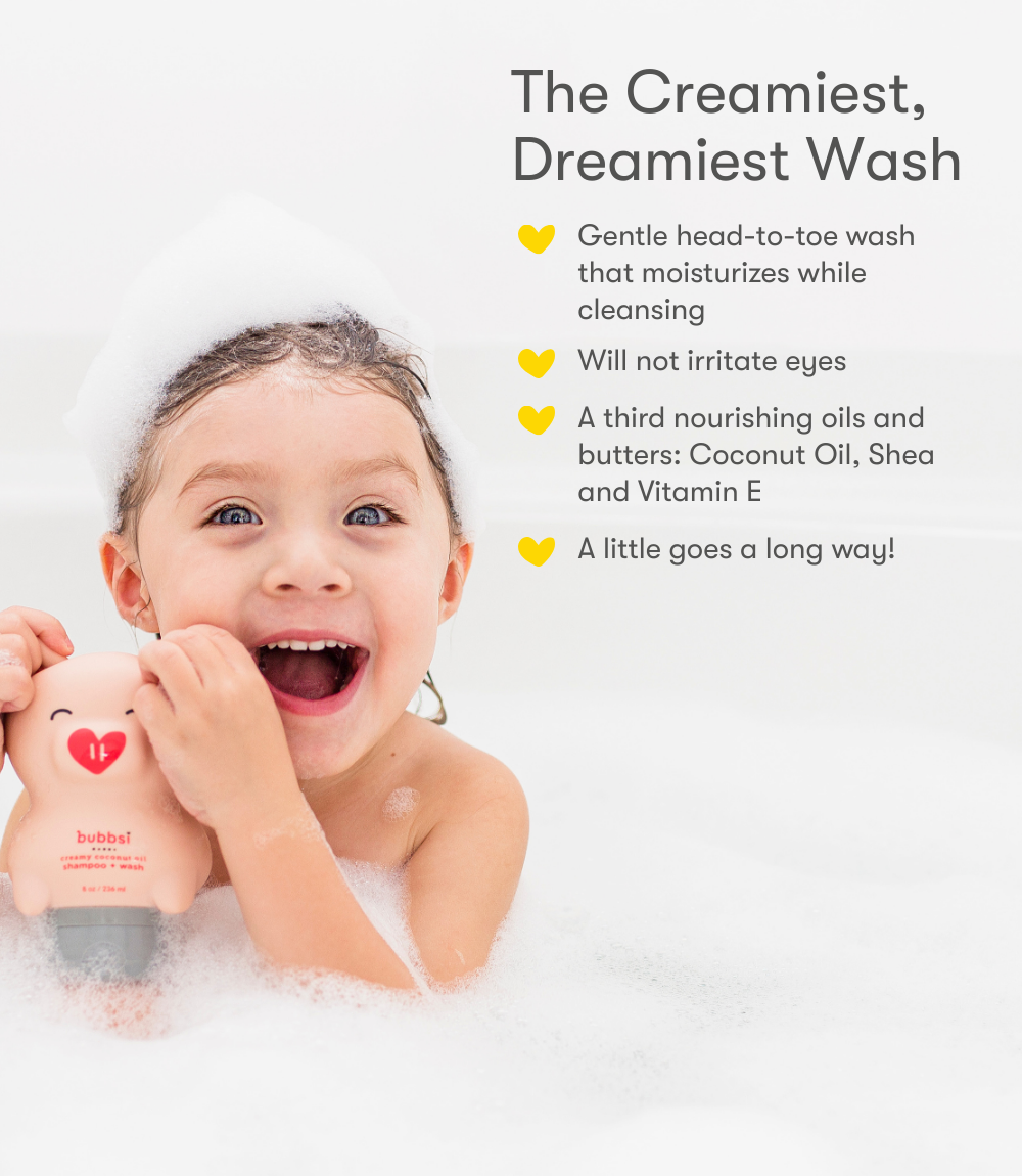Child in a bathtub holding a bottle of Bubbsi creamy coconut oil shampoo and wash with product features listed on a white background