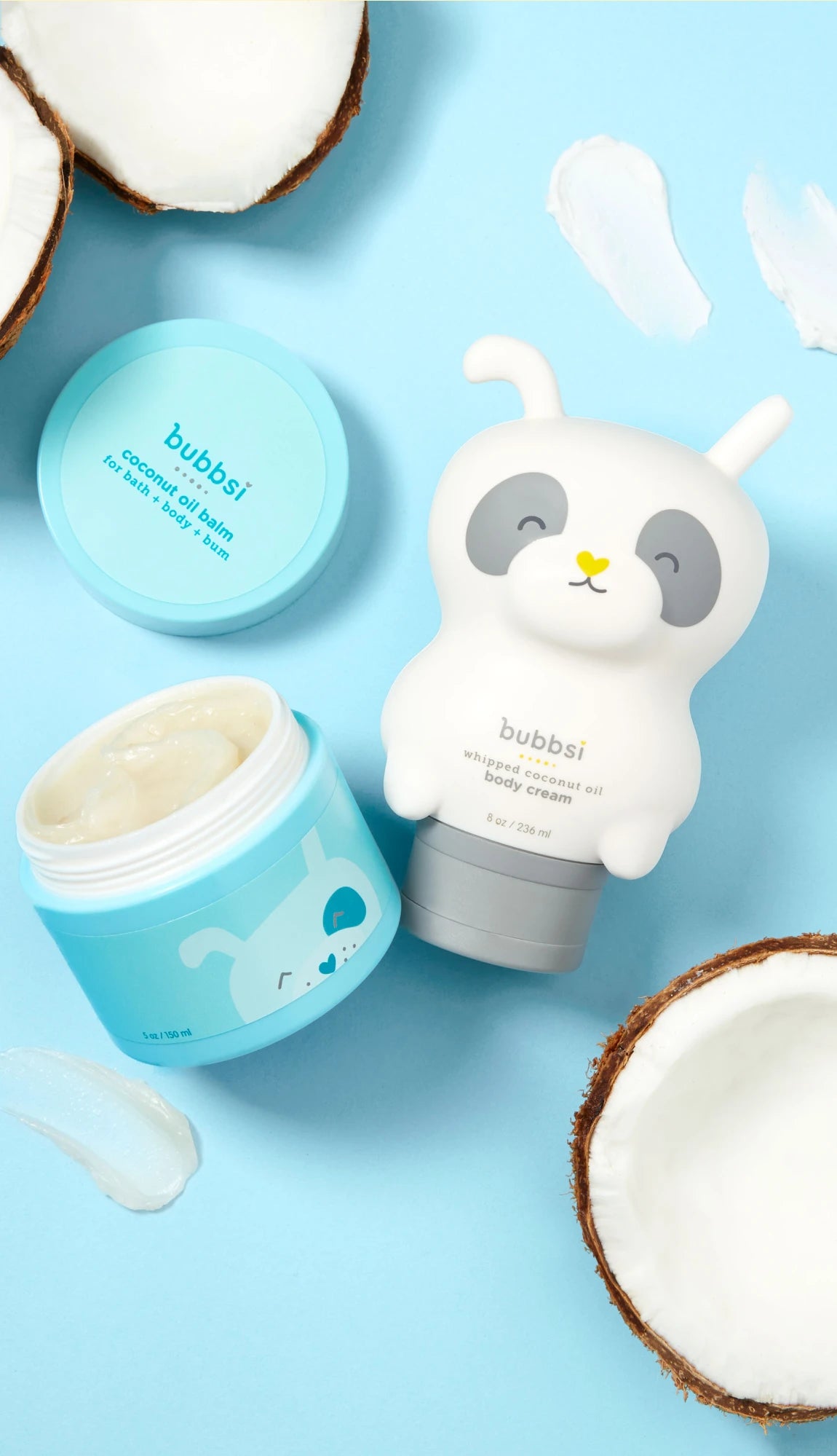 Bubbsi sensitive skin coconut oil based long-lasting skincare products on a blue background surrounded by coconuts and creamy product textures