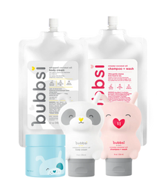 Collection of bubbsi baby products including body cream, shampoo & wash, and oil balm on a transparent background.